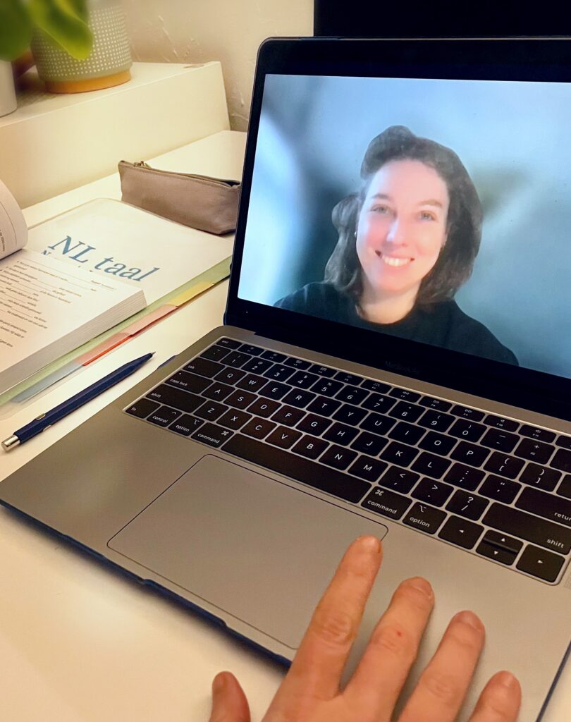Person teaching Dutch course online, laptop